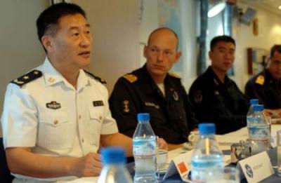 Wang&nbsp;Zhiguo&nbsp;(L),&nbsp;commander&nbsp;of&nbsp;the&nbsp;Chinese&nbsp;naval&nbsp;3rd&nbsp;escort&nbsp;fleet,&nbsp;talks&nbsp;with&nbsp;officials&nbsp;of&nbsp;the&nbsp;European&nbsp;Union&nbsp;(EU)&nbsp;navy&nbsp;465&nbsp;formation&nbsp;during&nbsp;his&nbsp;visit&nbsp;to&nbsp;the&nbsp;Dutch&nbsp;frigate&nbsp;"Eversten"&nbsp;at&nbsp;the&nbsp;invitation&nbsp;of&nbsp;the&nbsp;European&nbsp;Union&nbsp;(EU)&nbsp;navy&nbsp;465&nbsp;formation&nbsp;in&nbsp;the&nbsp;Gulf&nbsp;of&nbsp;Aden,&nbsp;Nov.&nbsp;22,&nbsp;2009.&nbsp;(Xinhua/Guo&nbsp;Gang)