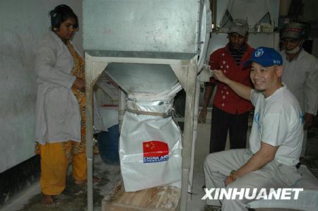 UN WFP's first Chinese anti-hunger ambassador, Li Ning, visits a town in northwest Bangladesh, Dec. 6, 2009.