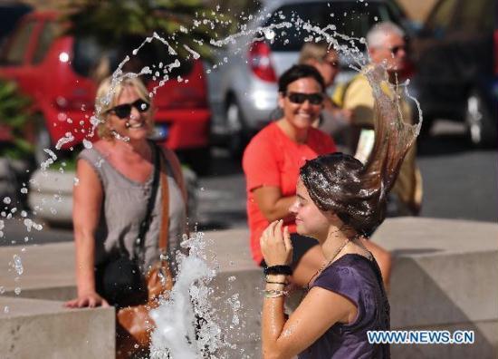 A girl cools off in a fountain in downtown Rome, capital of Italy, July 12, ... A girl cools off in a fountain in downtown Rome, capital of Italy, July 12, ...