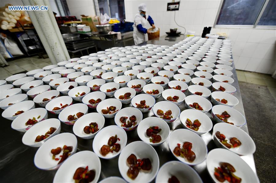 Photo taken on Jan. 12, 2020 shows the ingredients of making eight-treasure rice pudding, including raisins, Chinese wolfberries and honey dates, at a workshop in Zunyi, southwest China