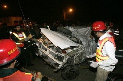 Pakistani&nbsp;officials&nbsp;examine&nbsp;the&nbsp;wreckage&nbsp;of&nbsp;a&nbsp;vehicle&nbsp;after&nbsp;a&nbsp;suicide&nbsp;bombing&nbsp;near&nbsp;Lahore,&nbsp;Pakistan,&nbsp;Monday,&nbsp;Nov.&nbsp;2,&nbsp;2009.&nbsp;Hours&nbsp;after&nbsp;a&nbsp;blast&nbsp;in&nbsp;Pakistan's&nbsp;capital,&nbsp;another&nbsp;suicide&nbsp;bomber&nbsp;struck&nbsp;in&nbsp;the&nbsp;eastern&nbsp;city&nbsp;of&nbsp;Lahore,&nbsp;exploding&nbsp;a&nbsp;car&nbsp;at&nbsp;a&nbsp;police&nbsp;checkpoint&nbsp;as&nbsp;officers&nbsp;went&nbsp;to&nbsp;search&nbsp;it.&nbsp;&nbsp;(AP&nbsp;Photo/K.M.&nbsp;Chaudary)&nbsp;