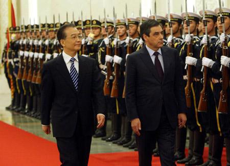 Chinese Premier Wen Jiabao (L) holds a welcoming ceremony for French Prime Minister Francois Fillon (R) at the Great Hall of the People in Beijing, capital of China, Dec. 21, 2009. (Xinhua/Liu Weibing) 