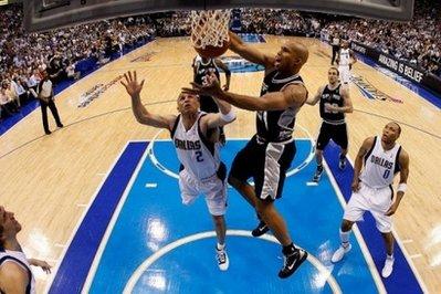 Richard Jefferson (center) of the San Antonio Spurs takes a shot against Jason Kidd of the Dallas Mavericks in Game Two of the Western Conference Quarterfinals during the 2010 NBA Playoffs at American Airlines Center in Dallas, Texas. San Antonio won 102-88 to level the series 1-1.(AFP/Getty Images/Ronald Martinez)