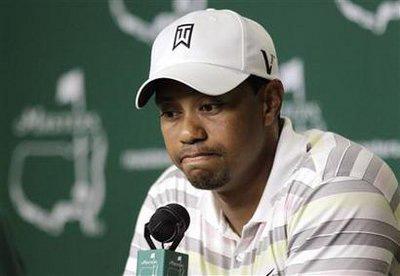 Tiger Woods pauses as he speaks at his news conference following his practice round for the 2010 Masters golf tournament at the Augusta National Golf Club in Augusta, Georgia, April 5, 2010. REUTERS/David J.Philip/Pool