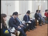 习近平会见韩国新国家党党首