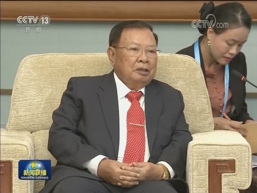 王沪宁会见老挝人革党中央总书记 国家主席
