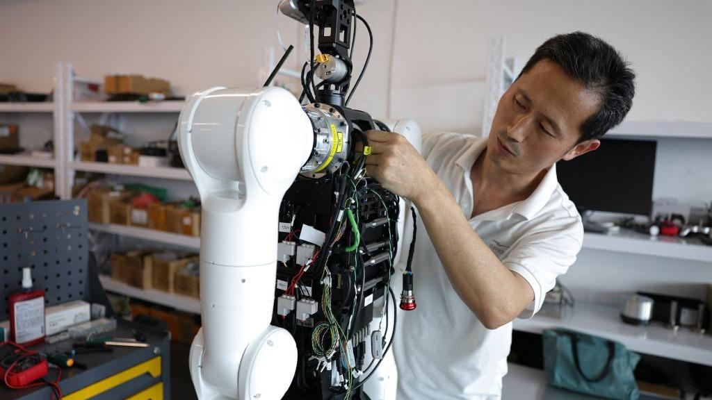 As AI races ahead, China bets on a people-centered digital future