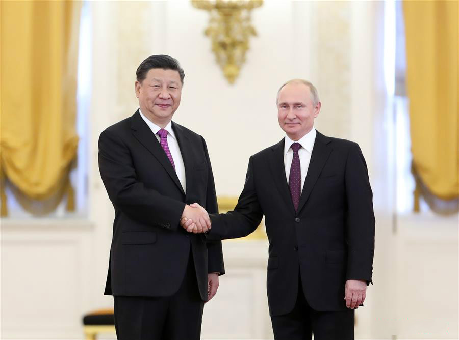 Chinese President Xi Jinping (L) shakes hands with his Russian counterpart Vladimir Putin while posing for photos ahead of their talks in Moscow, Russia, June 5, 2019. Xi Jinping held talks with Vladimir Putin at the Kremlin in Moscow on Wednesday. (Xinhua/Ding Haitao)