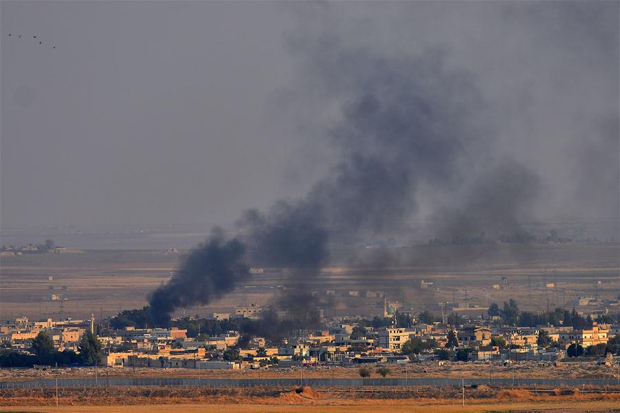 Photo taken from southern Turkish border town of Ceylanpinar on Oct. 10, 2019 shows smoke rising from the northern Syrian city of Ras al-Ain during an attack launched by Turkish army. Turkish airstrikes and howitzers have hit 181 targets in northern Syria as part of Operation Peace Spring, said Turkish Defense Ministry on Thursday. Turkish troops have entered 7 km deep into the border town of Tal Abyad in Syria, but the move is slower in the city of Ras al-Ain because of intense fire from the Syrian Kurdish People