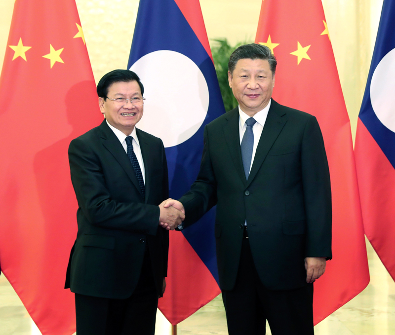 1月6日，国家主席习近平在北京人民大会堂会见老挝总理通伦。新华社记者 刘卫兵 摄