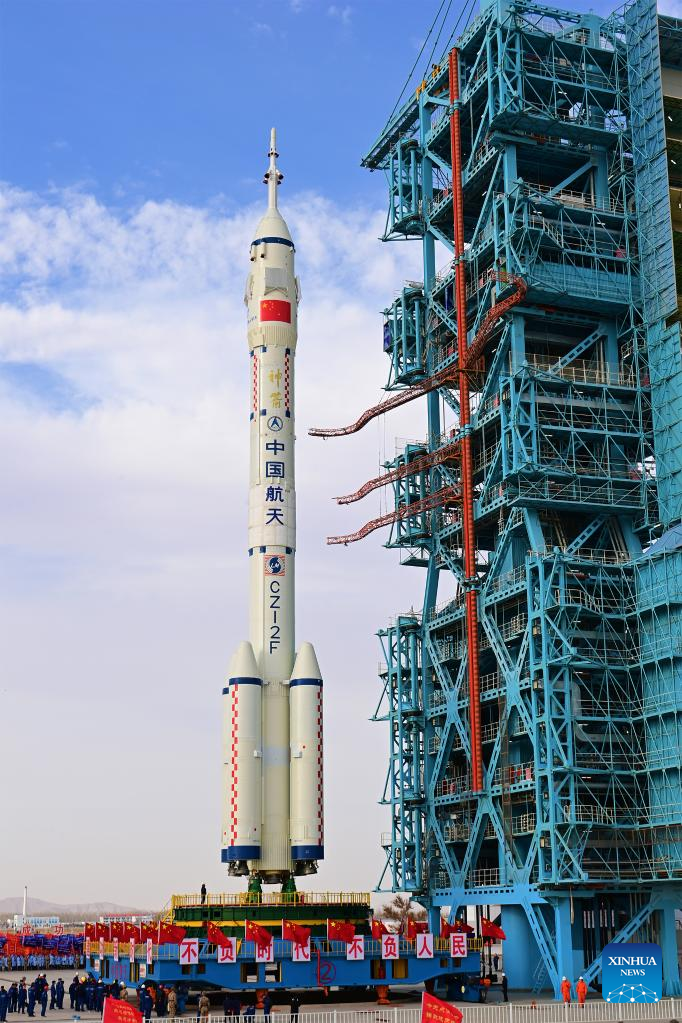 The combination of the Shenzhou-15 crewed spaceship and a Long March-2F carrier rocket is transferred to the launching area in Jiuquan Satellite Launch Center in northwest China, Nov. 21, 2022. (Photo by Wang Jiangbo/Xinhua)