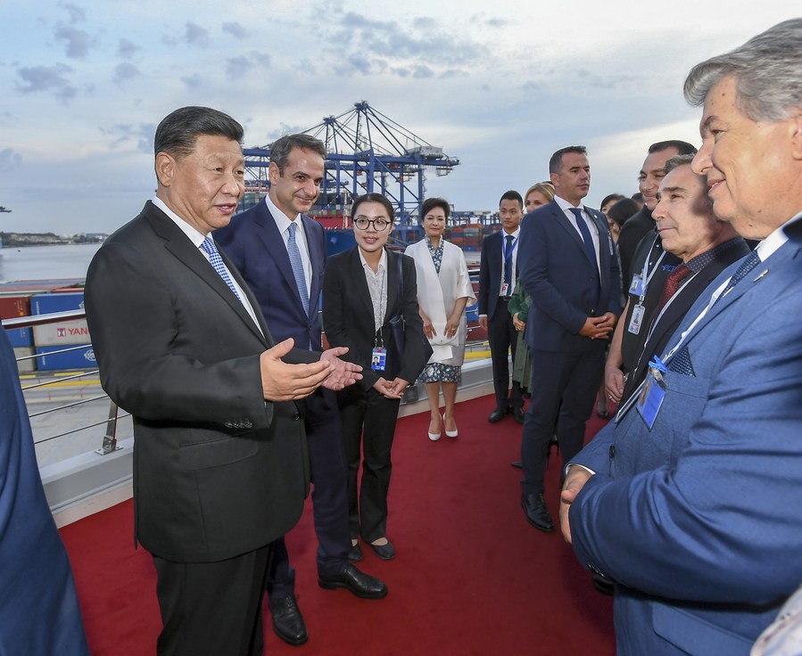 Chinese President Xi Jinping talks with representatives of local staff members as he visits the Piraeus Port in Greece, Nov. 11, 2019. (Xinhua/Xie Huanchi)