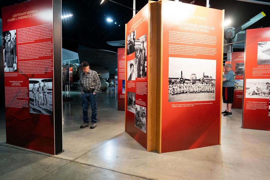 People visit a photo exhibition commemorating the Flying Tigers and Doolittle Raiders, Americans who fought Japan in World War II in cooperation with the Chinese people, at the National Museum of the U.S. Air Force in Dayton, Ohio, the United States, April 18, 2024. (Xinhua/Liu Jie)