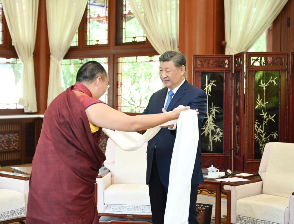 Panchen Erdeni Chos-kyi rGyal-po presents a hada to Chinese President Xi Jinping, also general secretary of the Communist Party of China Central Committee and chairman of the Central Military Commission, at Zhongnanhai in Beijing, capital of China, June 6, 2025. Xi received a visit from Panchen Erdeni Chos-kyi rGyal-po here on Friday. (Xinhua/Xie Huanchi)