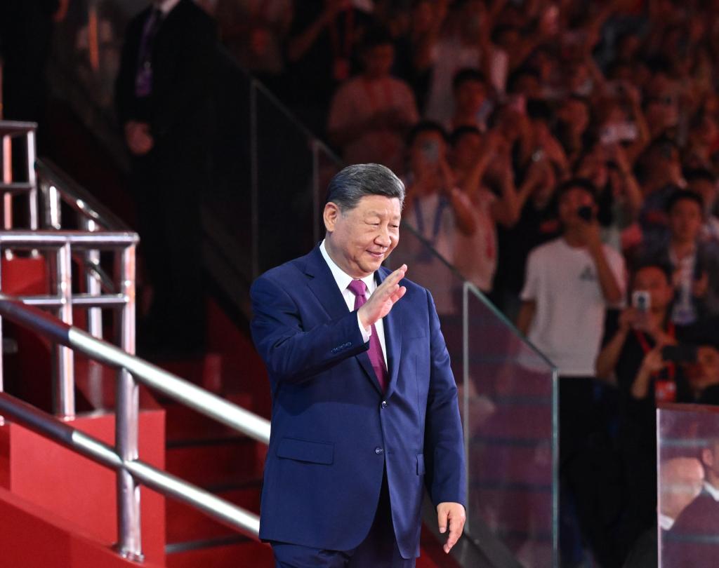 Chinese President Xi Jinping, also general secretary of the Communist Party of China Central Committee and chairman of the Central Military Commission, waves during the opening ceremony of China